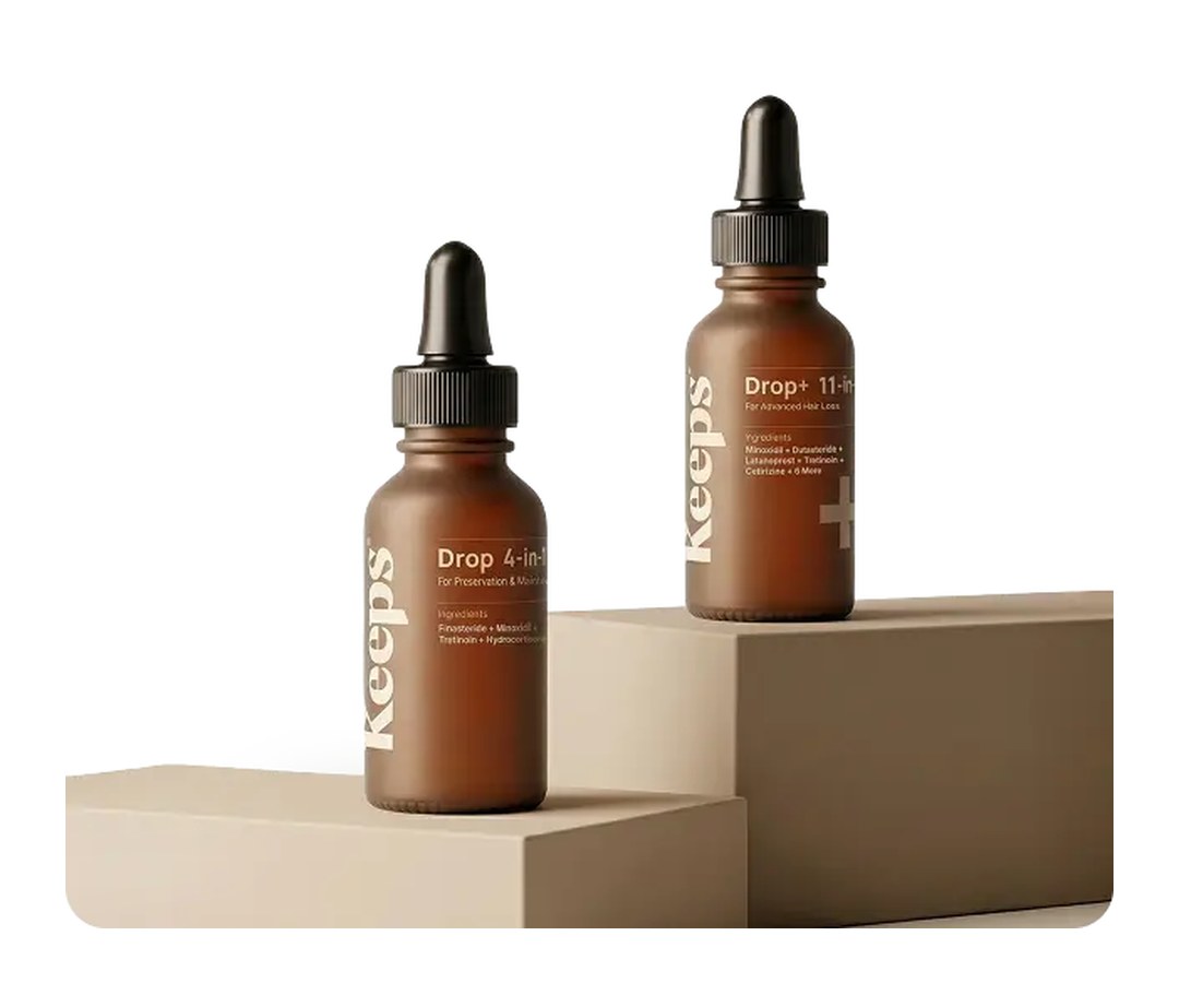 Keeps Drop 4-in-1 and Drop+ 11-in-1 topical bottles on beige display blocks